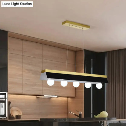 Modern gold & wood pendant light with black & white shade dining room