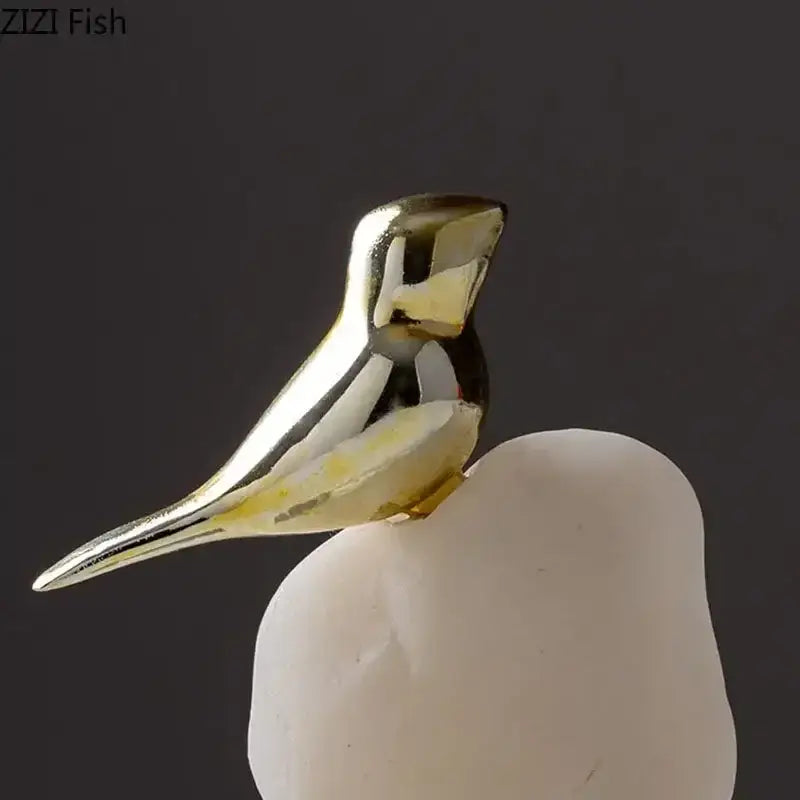 Modern golden bird statue with stone base living room ornament