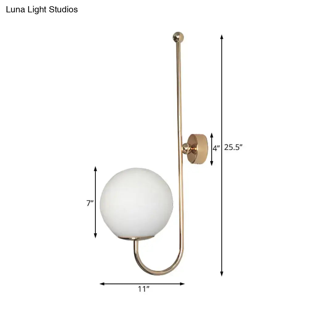 Modern golden gooseneck wall sconce with frosted glass ball bedroom