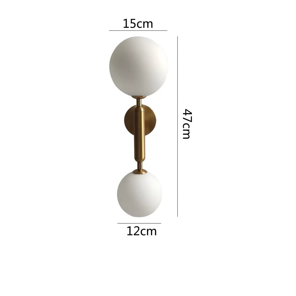 Modern golden led wall sconce with milky glass globes for bedroom