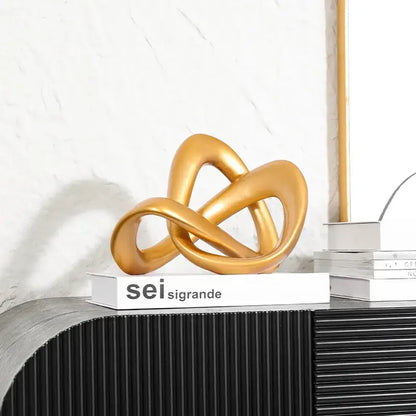 Modern golden twisted dough rope knot sculpture living room decor