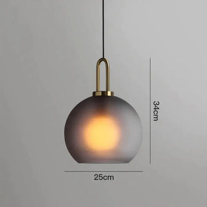 Modern gray glass ball pendant lights – dining room brass accents