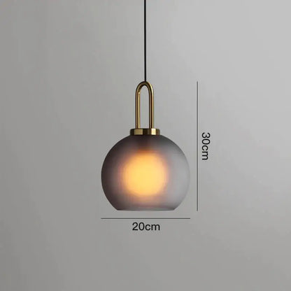Modern gray glass ball pendant lights – dining room brass accents