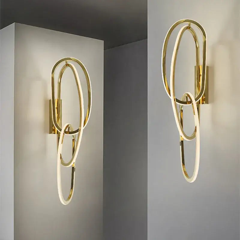 Modern interlocking oval gold wall sconce lighting fixture bedroom