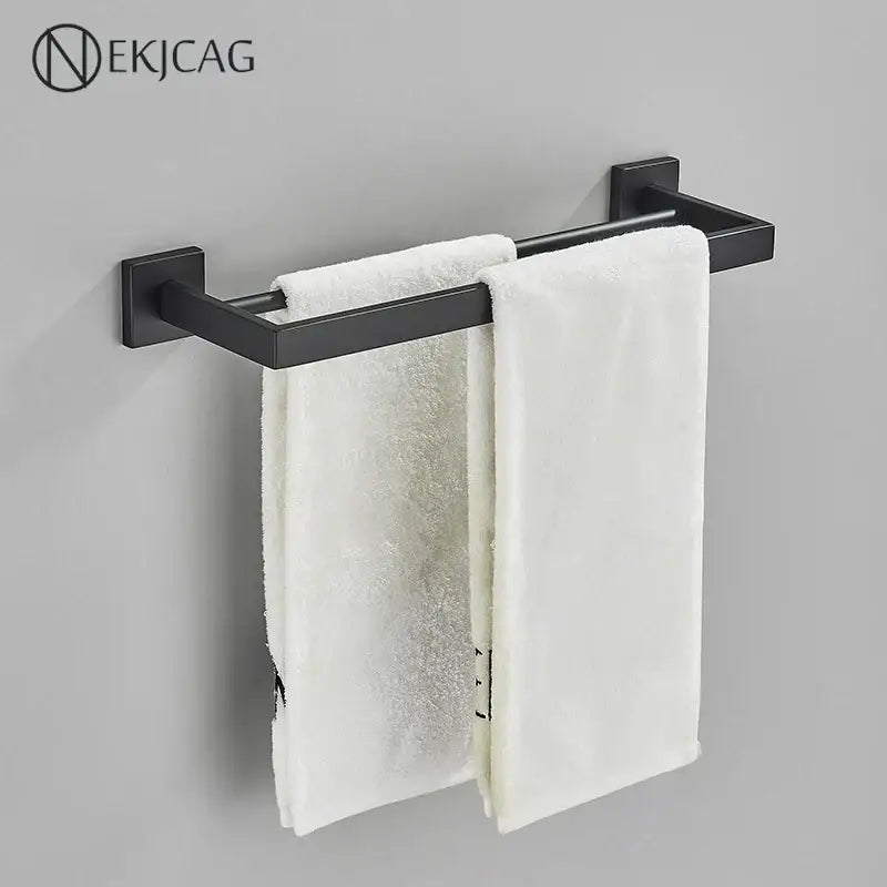 Modern matte black bathroom set with towel rack and gold rod accessories