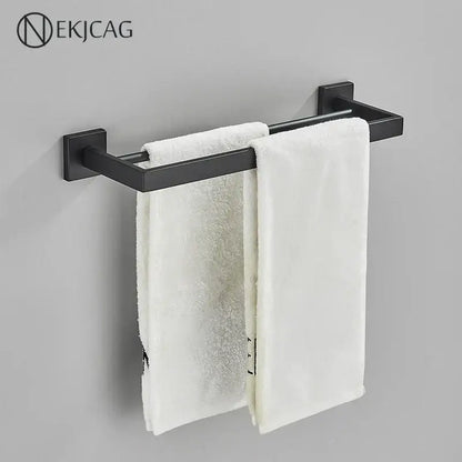 Modern matte black bathroom set with towel rack and gold rod accessories