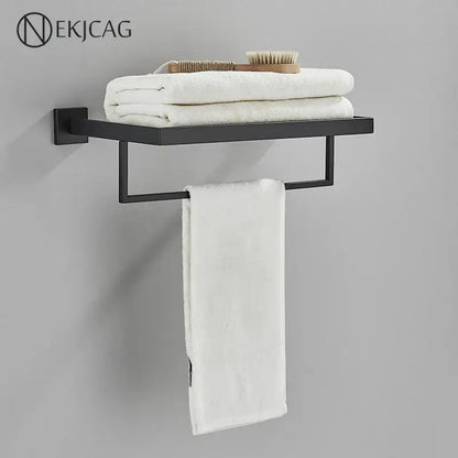 Modern matte black bathroom set with towel rack and gold rod accessories