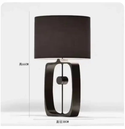 Modern matte black metal table lamp with fabric shade for living room