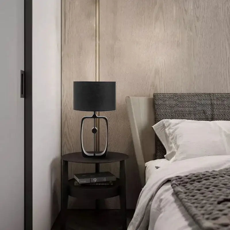 Modern matte black metal table lamp with fabric shade for living room