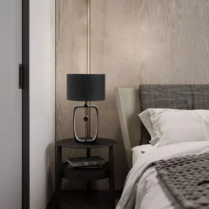 Modern matte black metal table lamp with fabric shade for living room