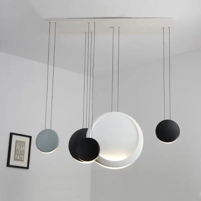 Modern matte black & muted green crescent moon chandelier dining room