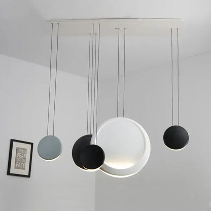 Modern matte black & muted green crescent moon chandelier dining room