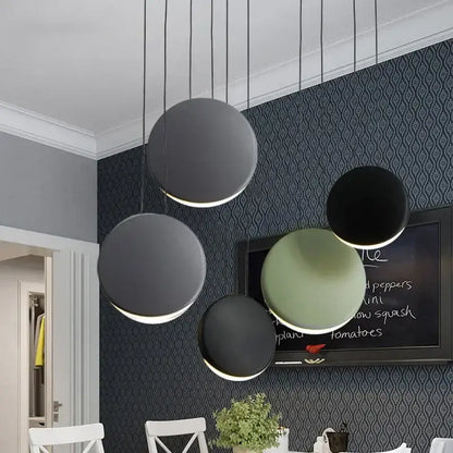 Modern matte black & muted green crescent moon chandelier dining room