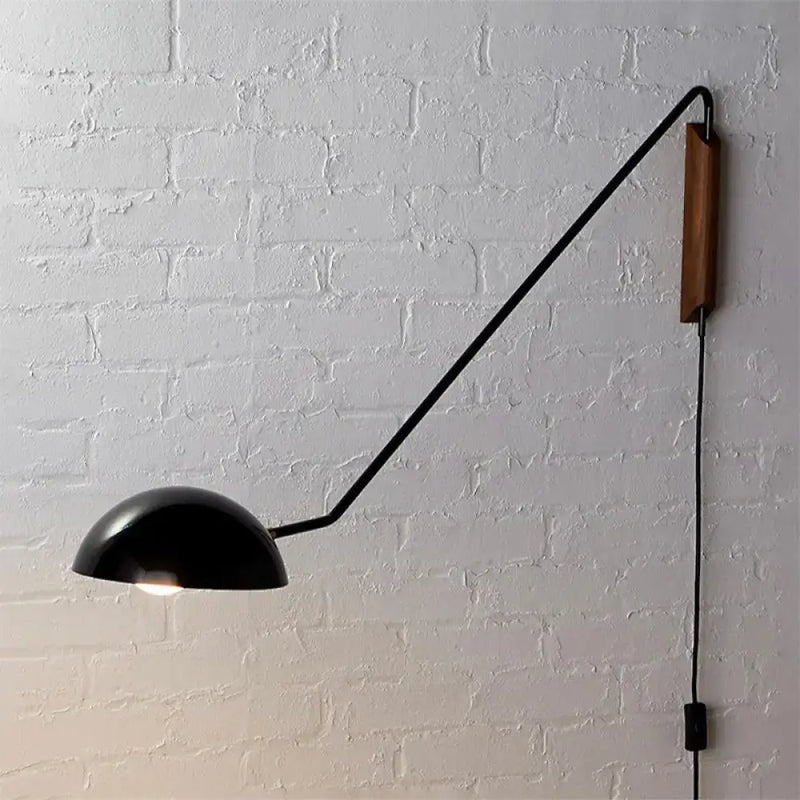 Modern matte black swing arm bedside wall lamp with wood accent bedroom