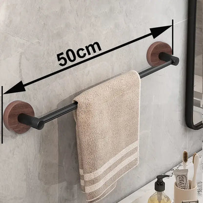 Modern matte black wall mounted towel bar with wood accents bathroom