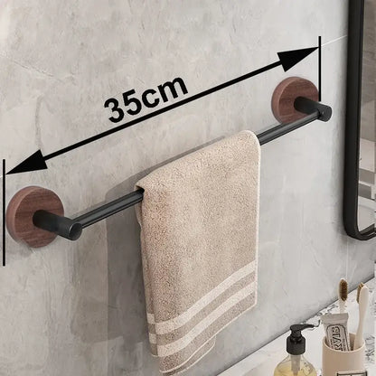 Modern matte black wall mounted towel bar with wood accents bathroom