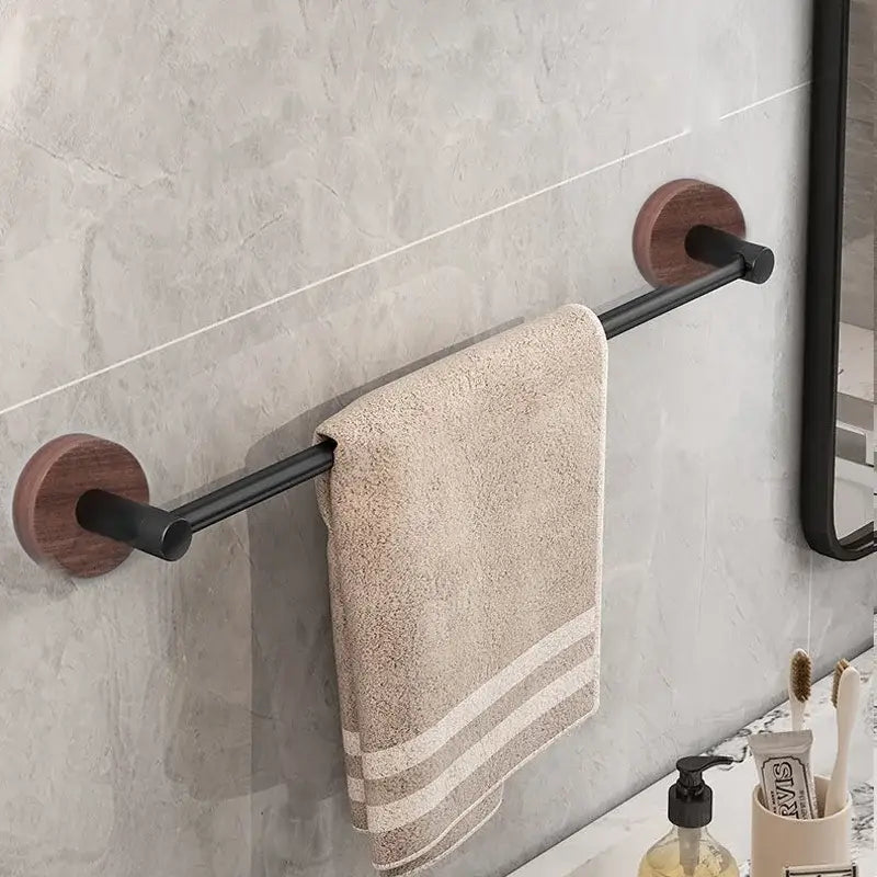 Modern matte black wall mounted towel bar with wood accents bathroom