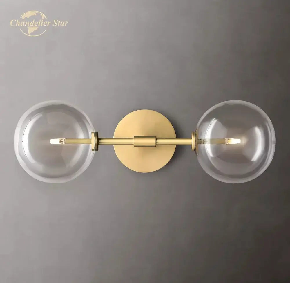 Modern metallic clear glass globe wall sconce bedroom light