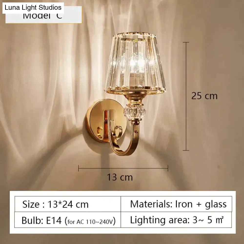 Modern minimalist gold wall lamp with crystal shade for bedroom