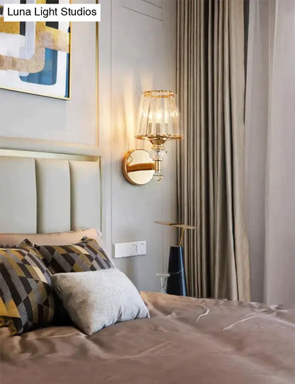 Modern minimalist gold wall lamp with crystal shade for bedroom