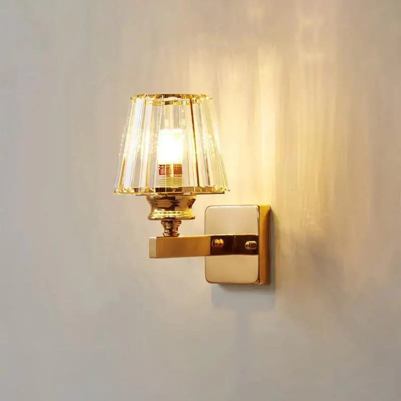 Modern minimalist gold wall lamp with crystal shade for bedroom