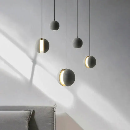 Modern minimalist gray and gold pendant light dining room