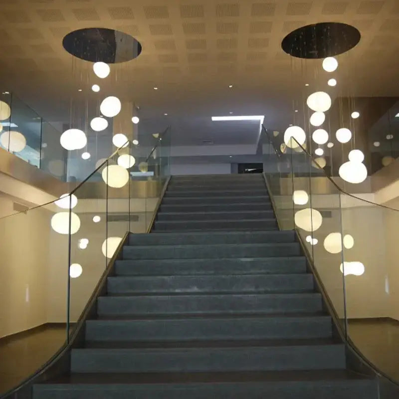 Modern minimalist white cobblestone glass led pendant light stairway