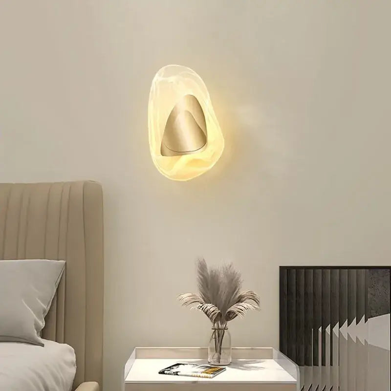 Modern oval crystal wall lamp for bedroom with abstract filament