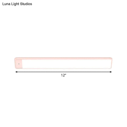Modern pink elongated vanity lighting fixture for bedroom