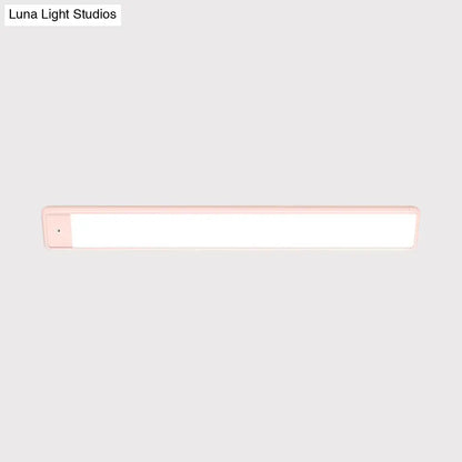 Modern pink elongated vanity lighting fixture for bedroom