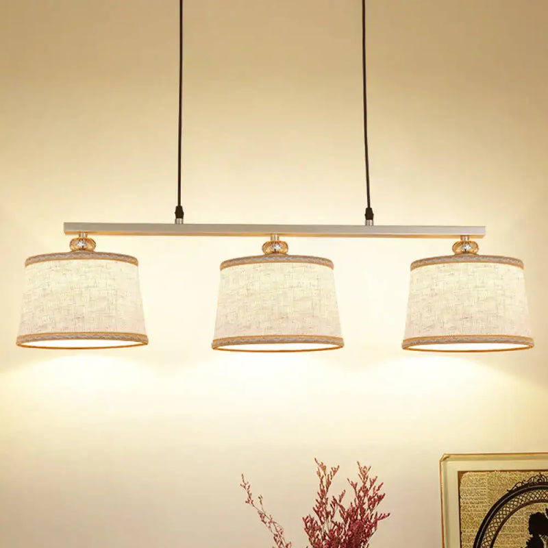 Modern silver and flaxen circle pendant light for kitchen island
