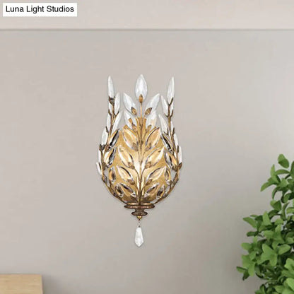 Modern silver & brass laurel wall light with crystal drop bedroom
