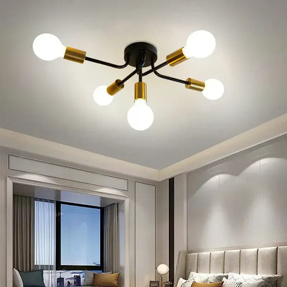 Modern symmetrical brass ceiling light with five spheres for living room