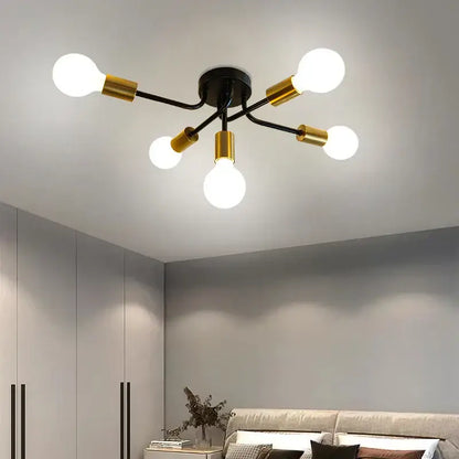 Modern symmetrical brass ceiling light with five spheres for living room