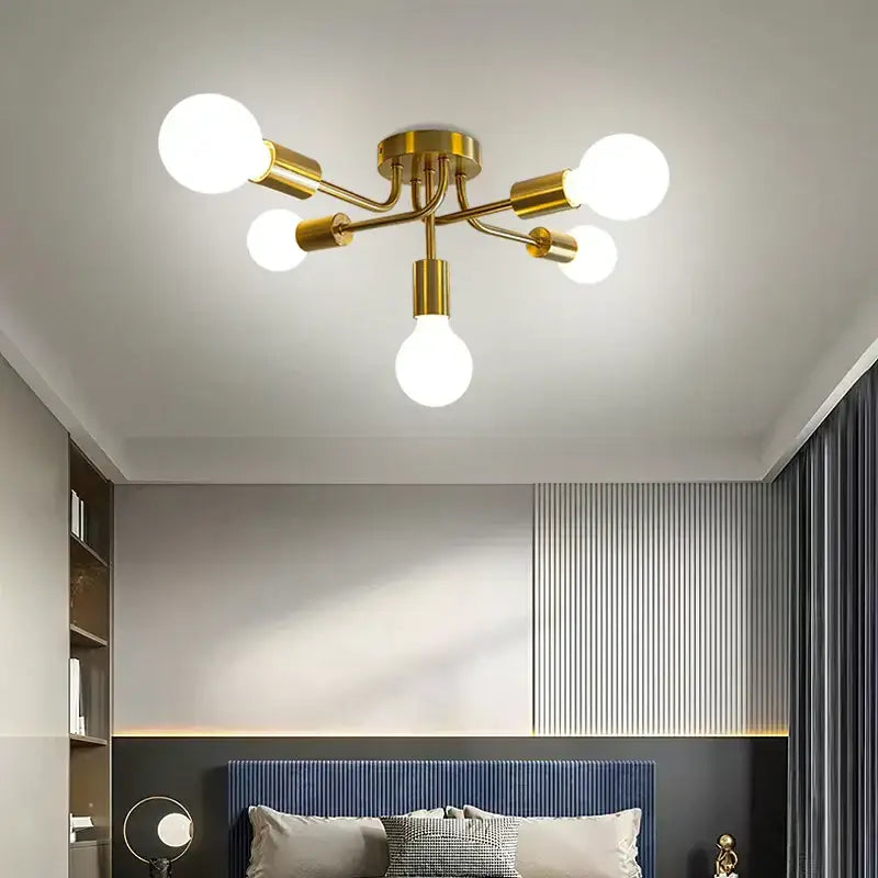 Modern symmetrical brass ceiling light with five spheres for living room