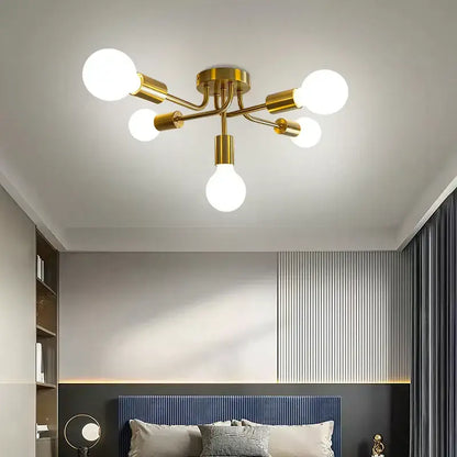 Modern symmetrical brass ceiling light with five spheres for living room