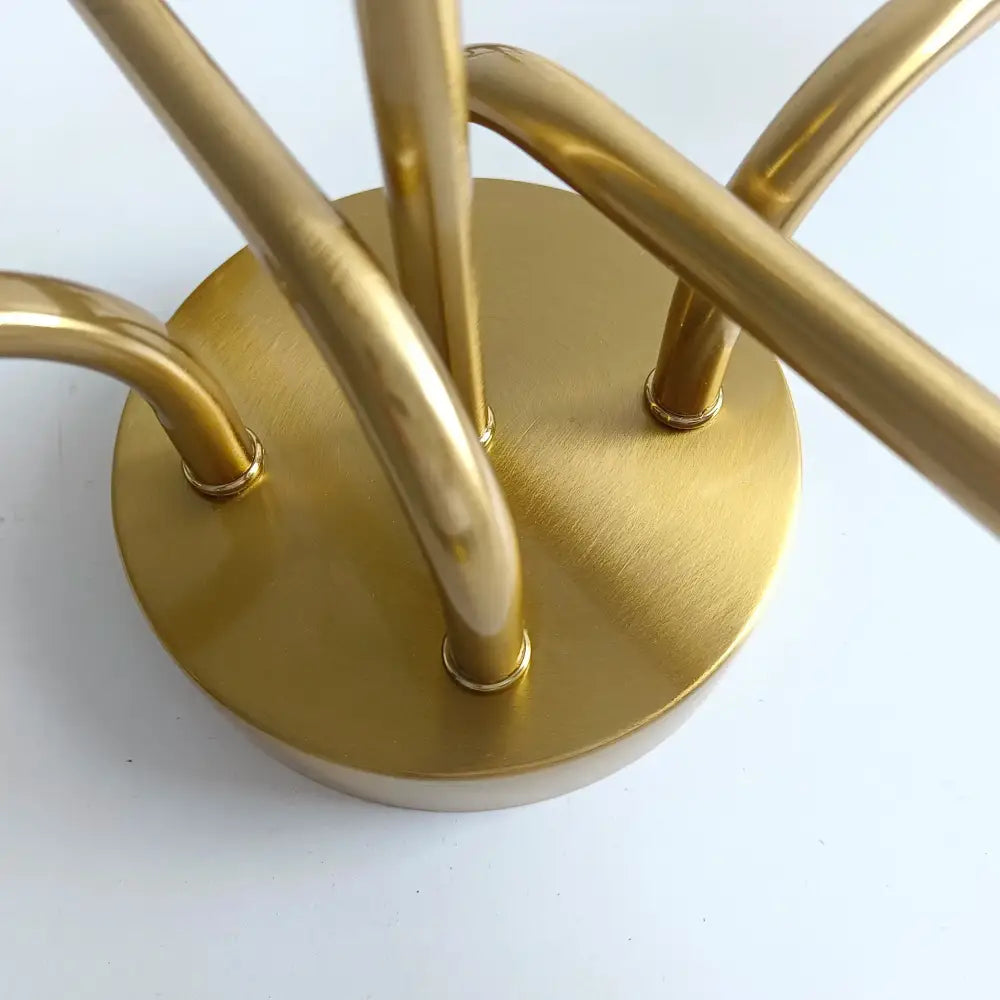 Modern symmetrical brass ceiling light with five spheres for living room