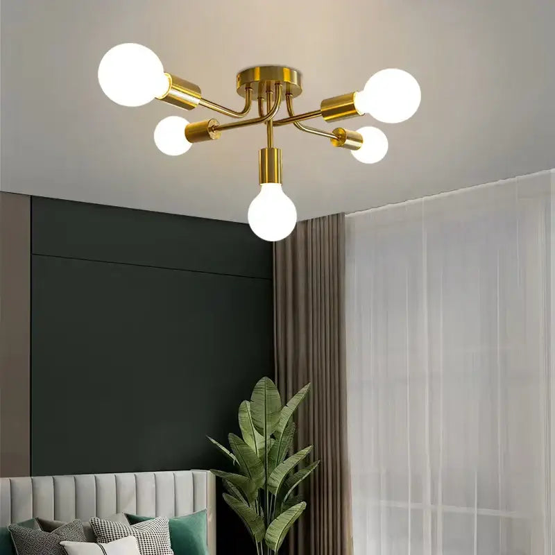 Modern symmetrical brass ceiling light with five spheres for living room