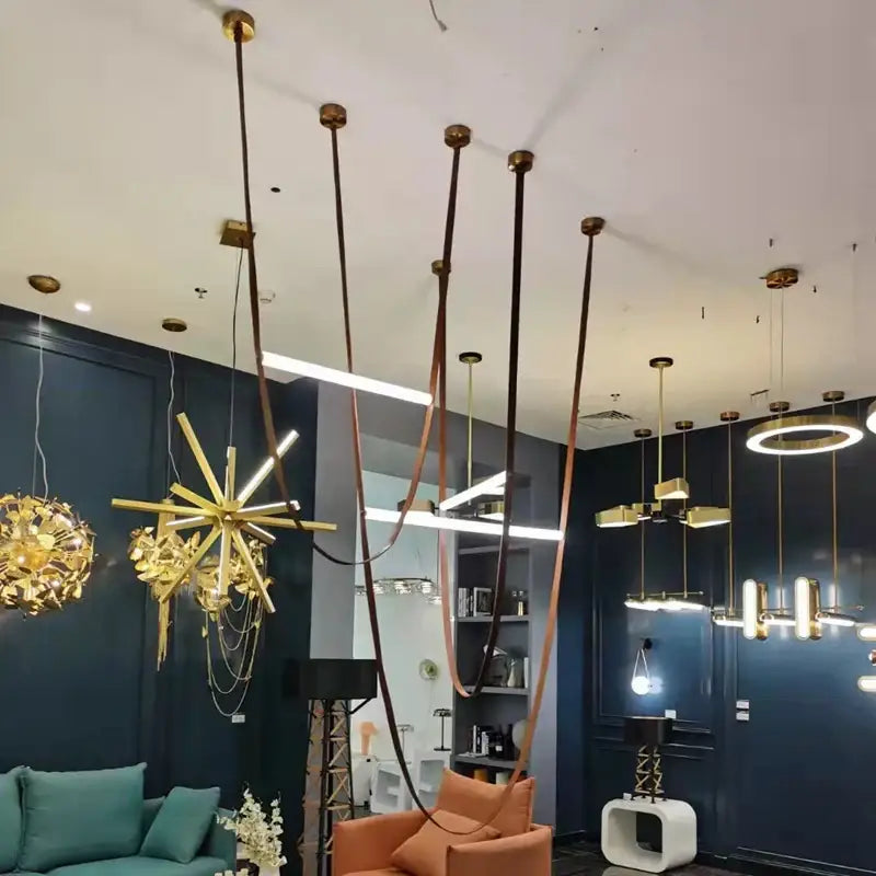 Modern tan leather and brass led tube suspension chandelier living room