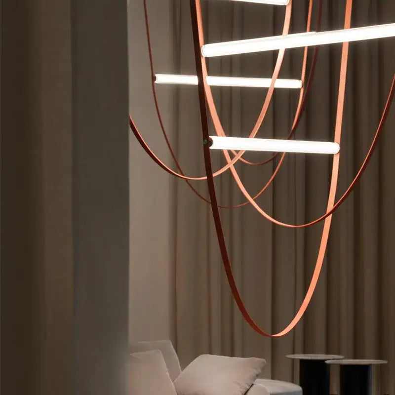 Modern tan leather and brass led tube suspension chandelier living room
