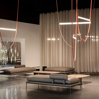Modern tan leather and brass led tube suspension chandelier living room