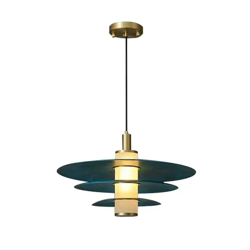 Modern teal glass and brass pendant light for kitchen island