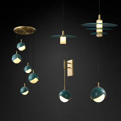 Modern teal glass and brass pendant light for kitchen island