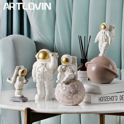 Modern white and gold astronaut phone holder living room figurine