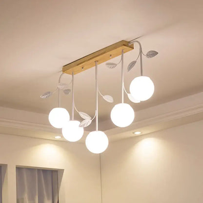 Modern white glass orb island light with wood canopy kitchen pendant