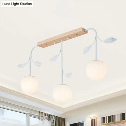 Modern white glass orb island light with wood canopy kitchen pendant