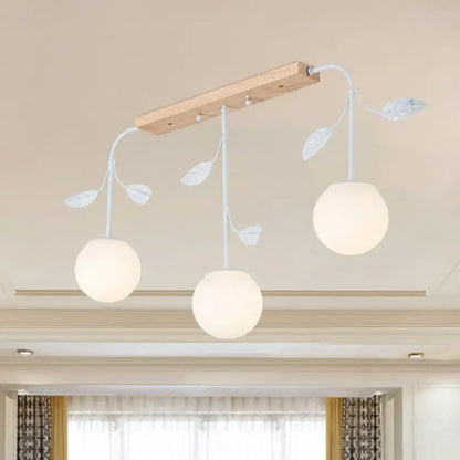 Modern white glass orb island light with wood canopy kitchen pendant