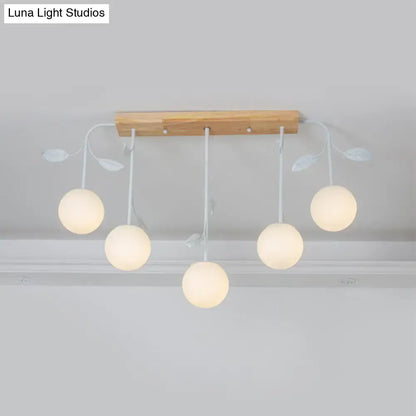 Modern white glass orb island light with wood canopy kitchen pendant
