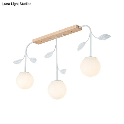 Modern white glass orb island light with wood canopy kitchen pendant