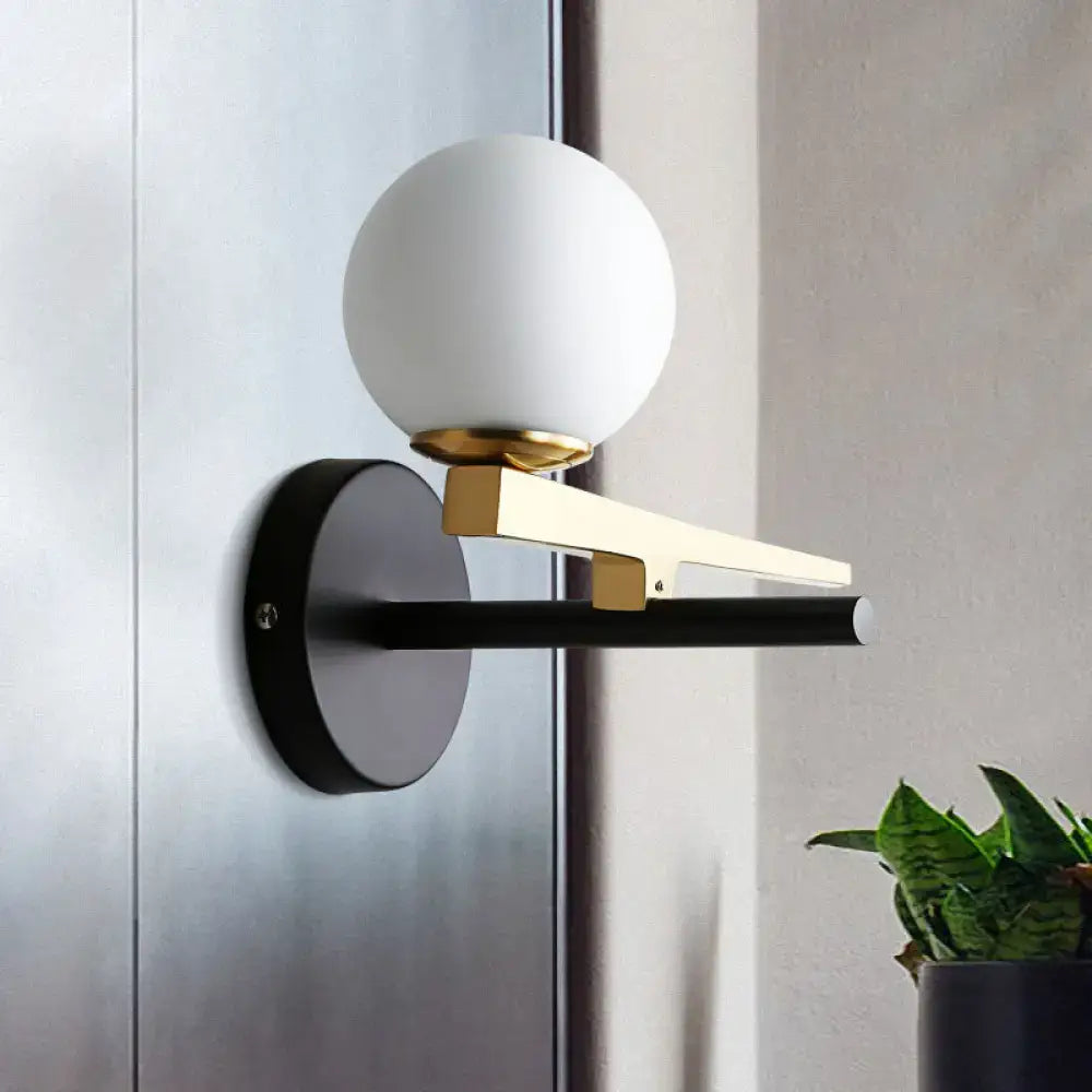 Modern white glass sphere wall light gold & black single light bedroom
